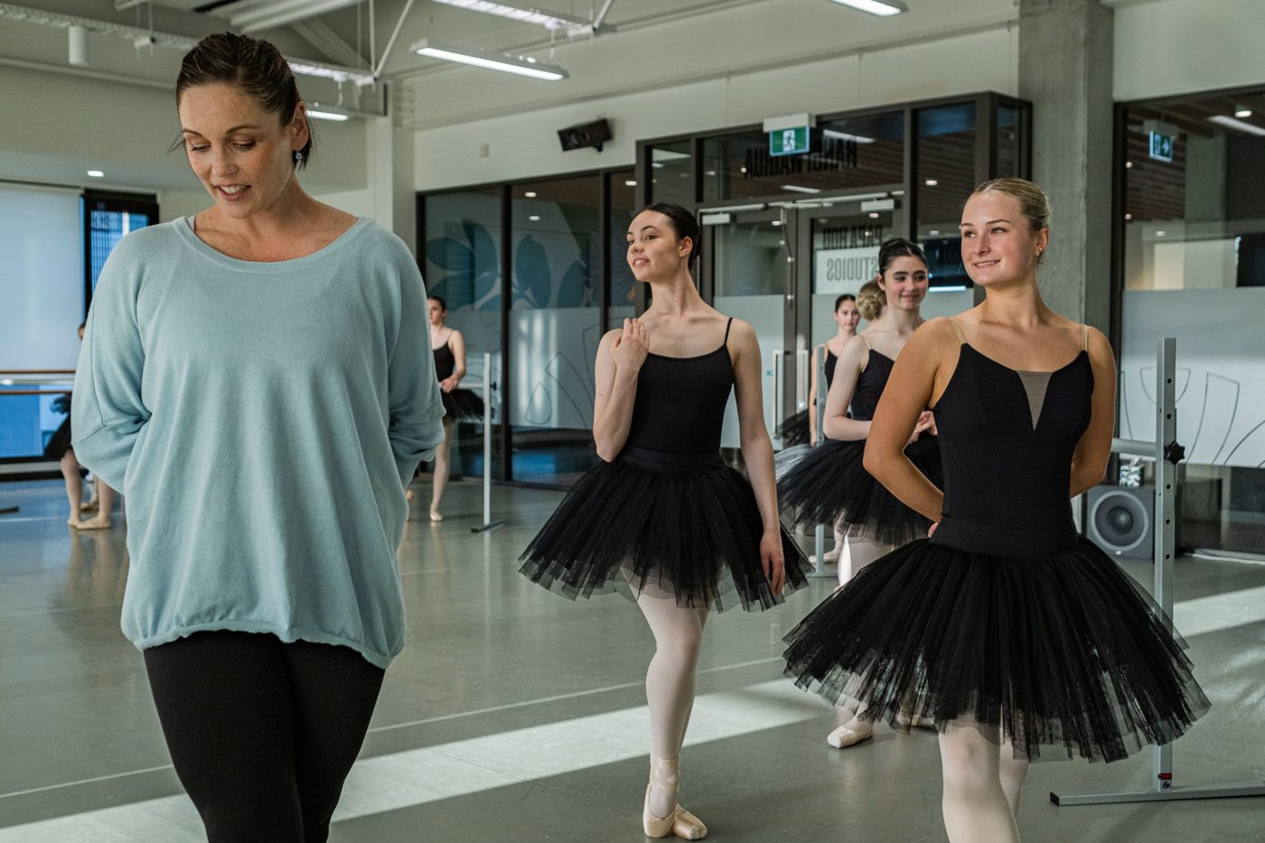 3 ballet dancers in black tutus with dance teacher Abigail Boyle